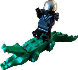 lego minifigure on top of a lego crocodile.